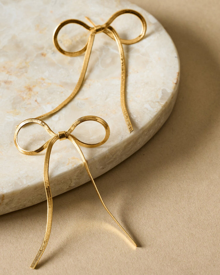 Katie Loxton: Amelie Waterproof Gold Bow Oversized Earrings